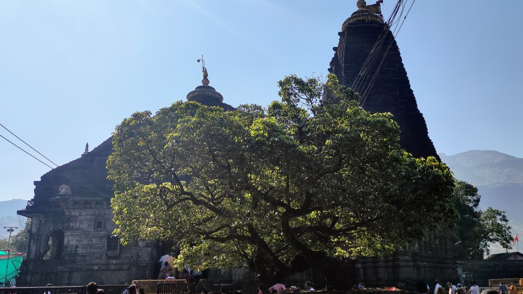 The dark stone architecture of Trimbakeshwar Jyotirlinga in Maharashtra.