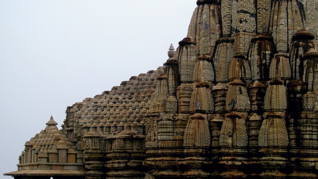 The complex spire and stone carvings of the Eklingji Temple in Rajasthan.
