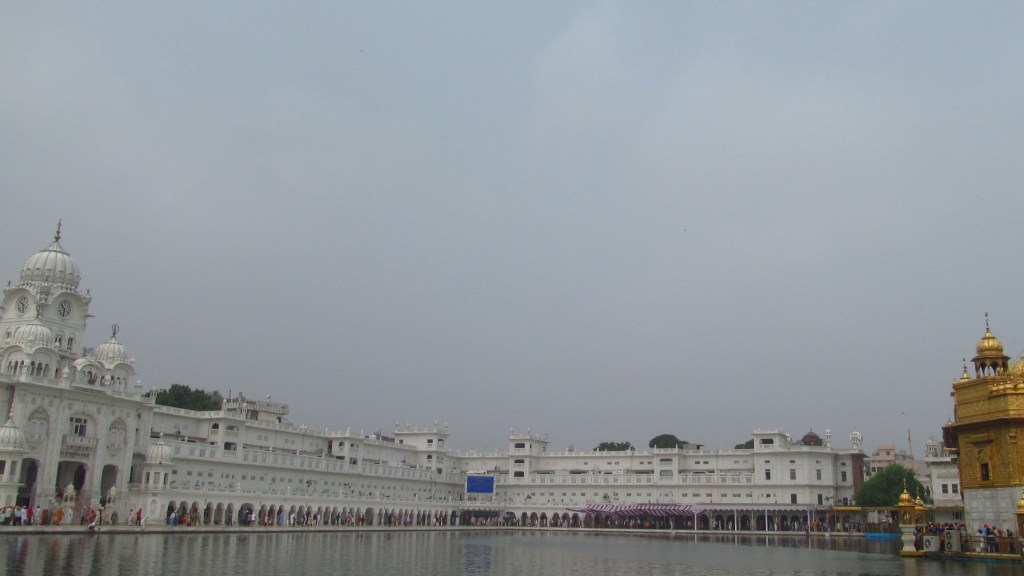 The marble and gold architecture of the Golden Temple, reflecting communal worship.