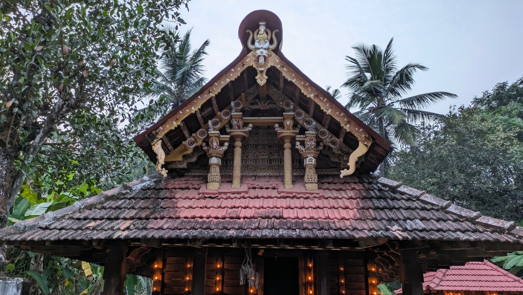 A simple temple in Kannur during Sandhya (evening) having simple Wood work.